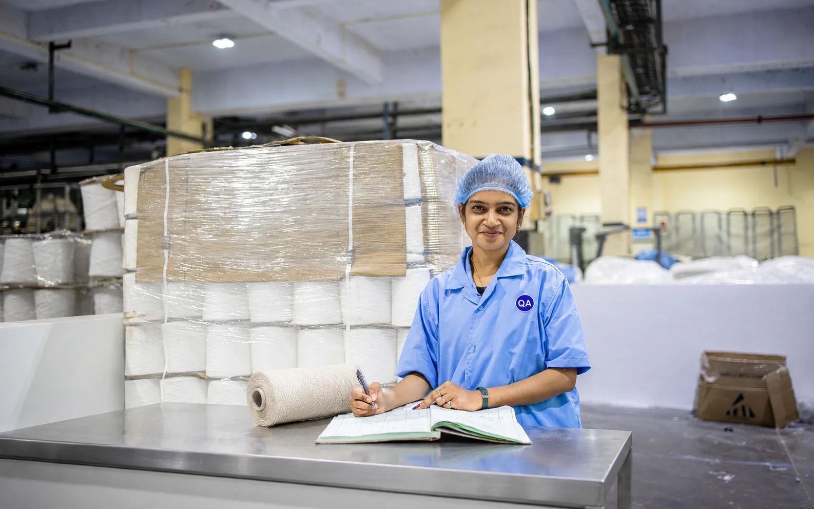 Textile material rolls inside a manufacturing facility