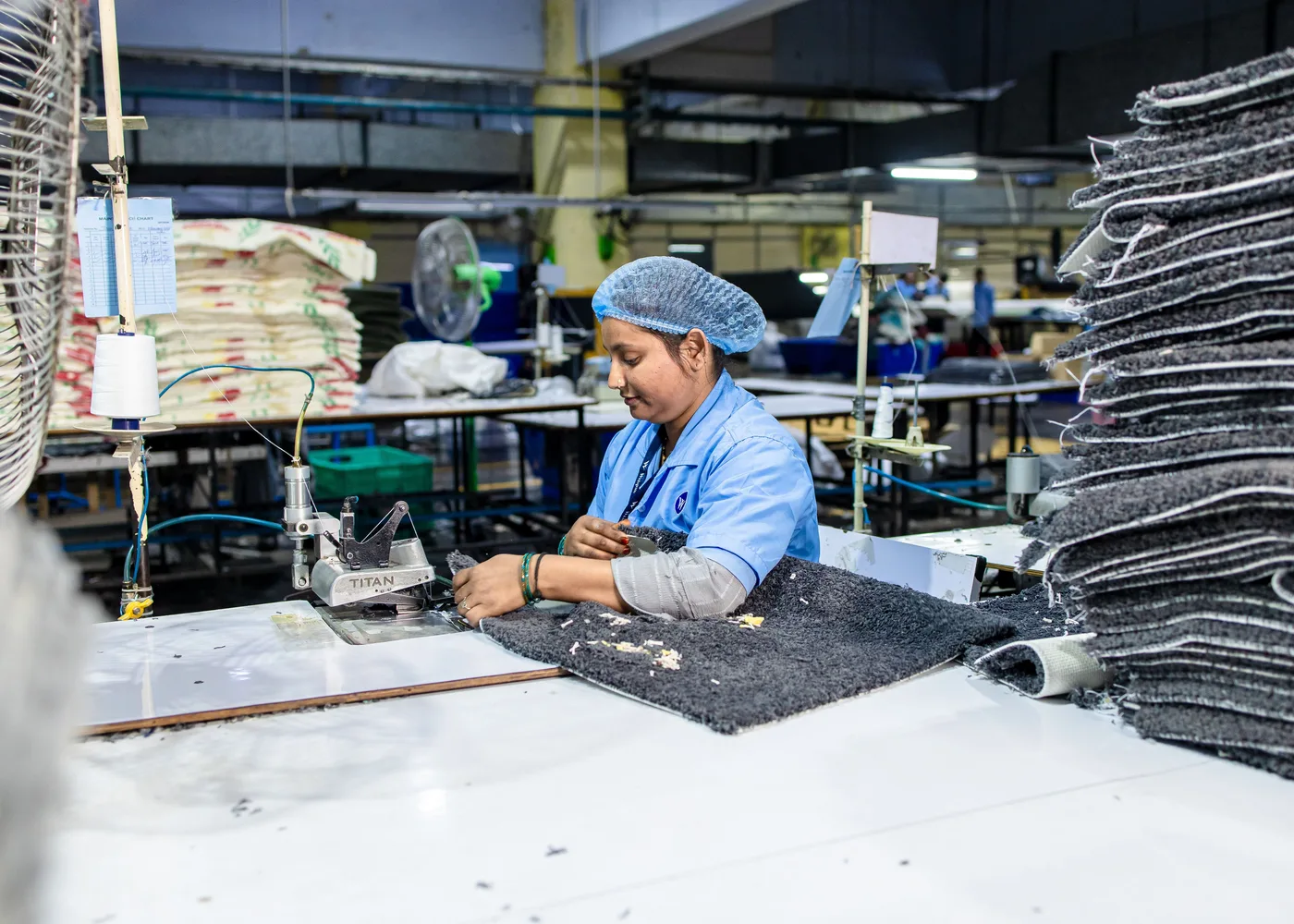 Garment production work on industrial sewing equipment